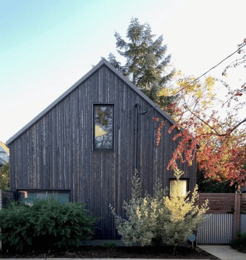 a house with a fence and trees