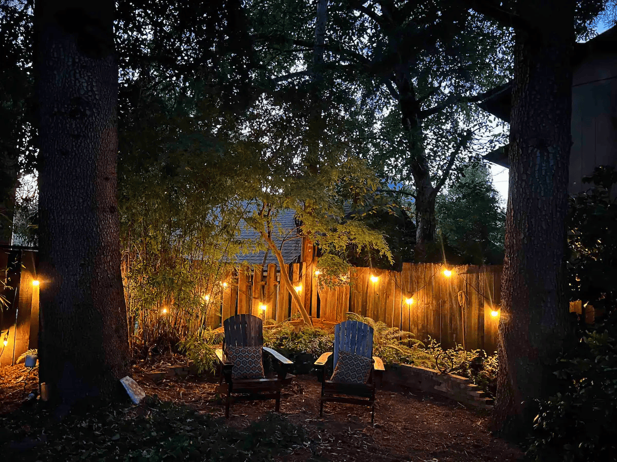chairs in a backyard with lights