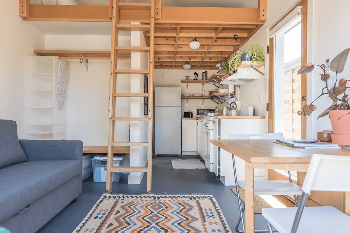 a room with a ladder and a table